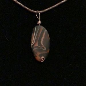 Swirly stone wrapped pendant